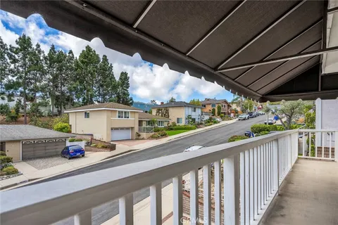 a view of a street from a balcony