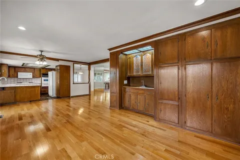 a view of a kitchen with a sink and refrigerator
