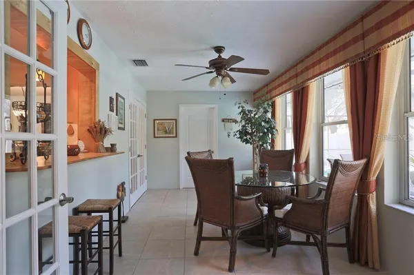 a view of a dining room with furniture window and outside view