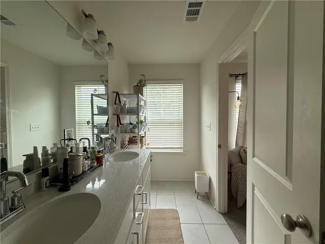 a bathroom with a toilet and a sink