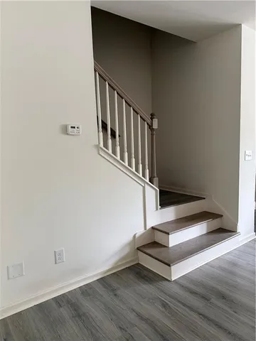 a bed room with bed and windows