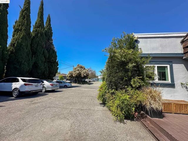 a view of street with parked cars
