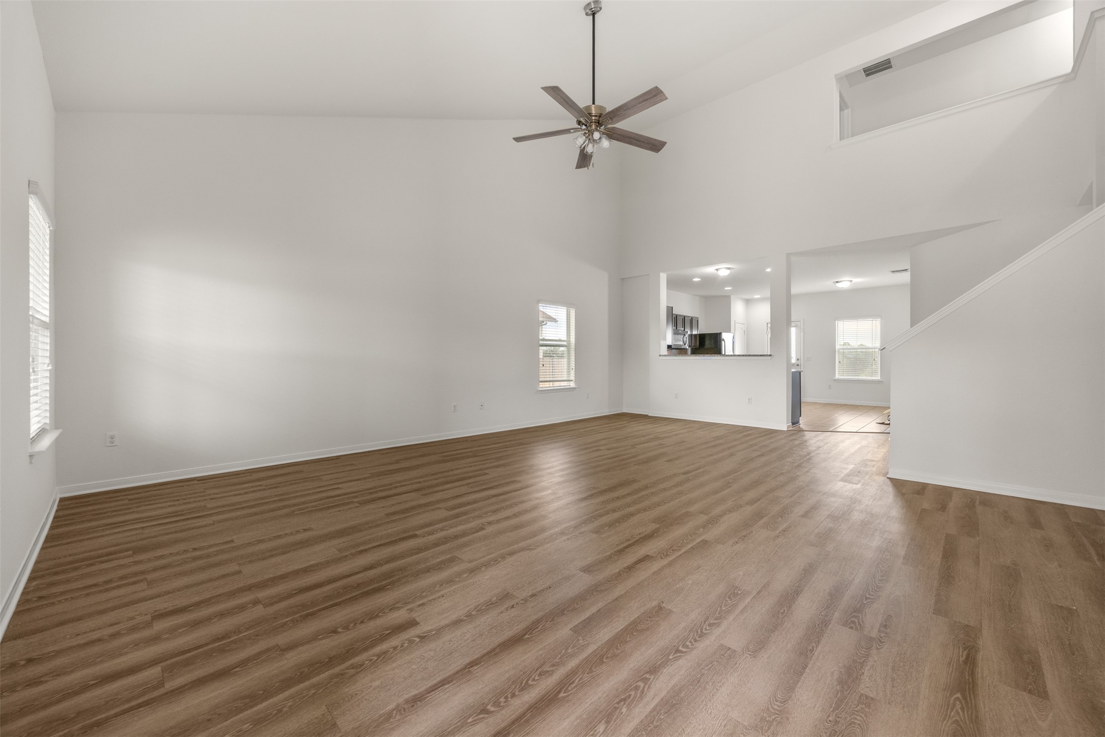 703 Liard River Road Hutto, TX 78634 - Photo 2 of 16 An airy living space with soaring vaulted ceilings and rich wood flooring awaits your personal touch.