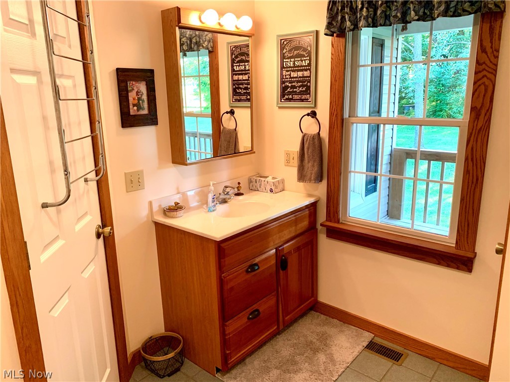 373 South Ridge Road West Conneaut, OH 44030 - Photo 22 of 50 Bathroom featuring tile floors and large vanity