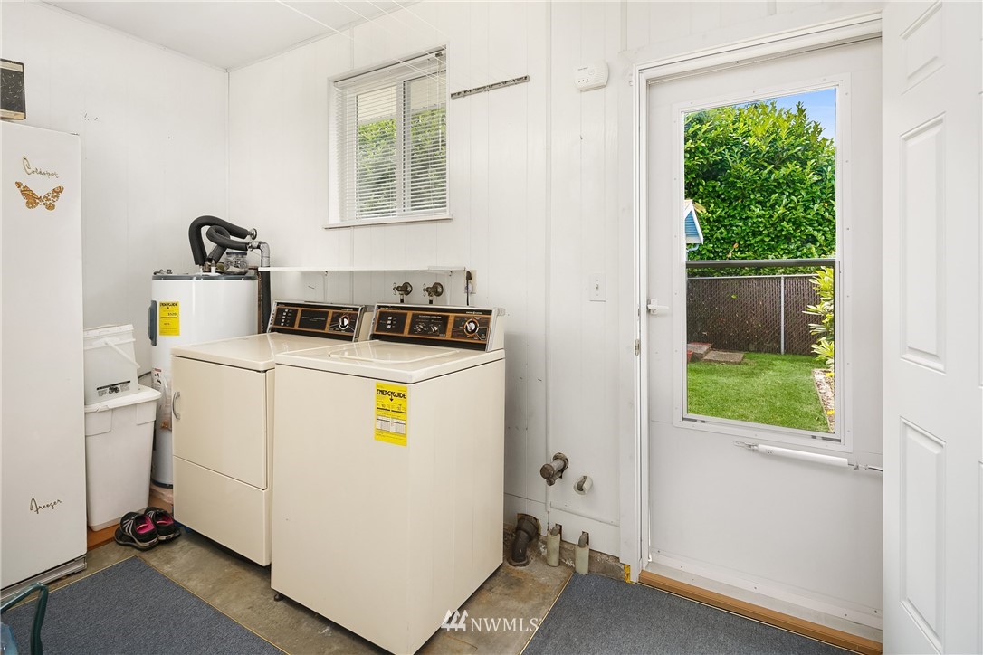 859 Monroe Avenue Northeast Renton, WA 98056 - Photo 19 of 23 a utility room with fridge dryer and washer