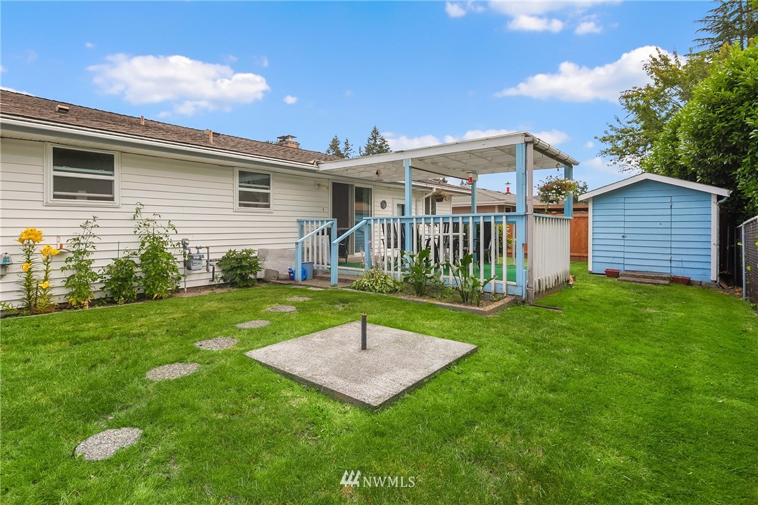 859 Monroe Avenue Northeast Renton, WA 98056 - Photo 20 of 23 a view of a house with a backyard
