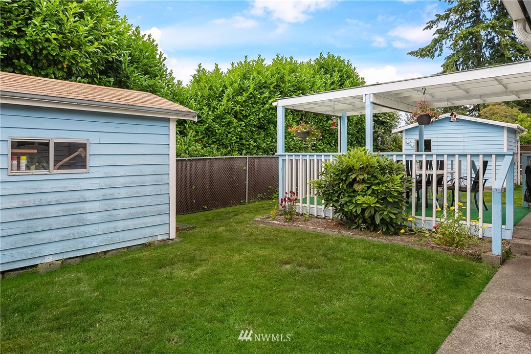 859 Monroe Avenue Northeast Renton, WA 98056 - Photo 21 of 23 a view of a house with a yard and plants