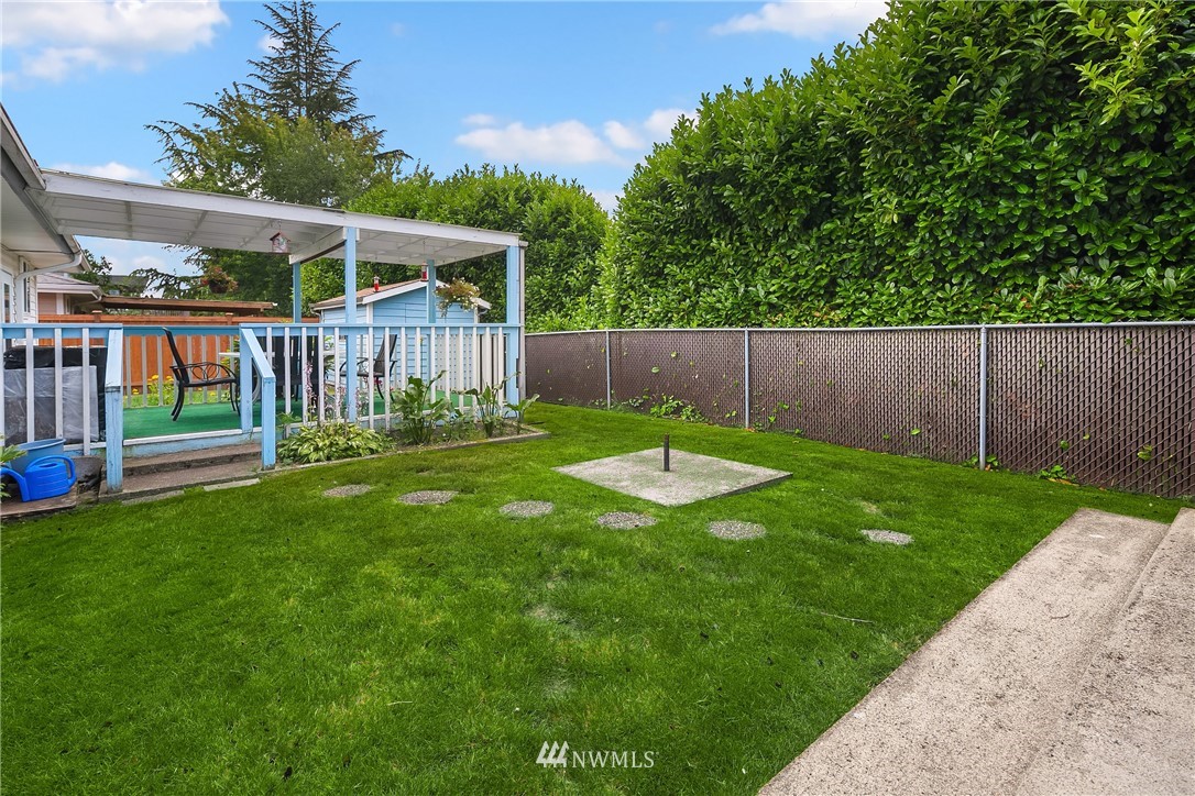 859 Monroe Avenue Northeast Renton, WA 98056 - Photo 23 of 23 a view of a backyard with a garden
