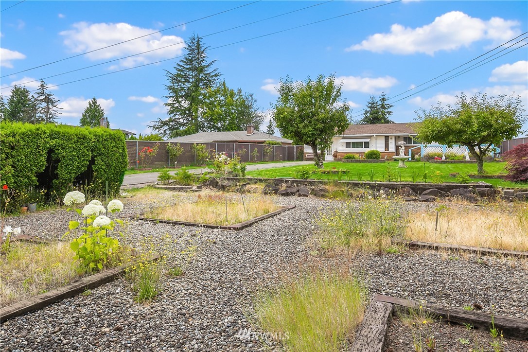 859 Monroe Avenue Northeast Renton, WA 98056 - Photo 5 of 23 a view of a lake with a house in the background