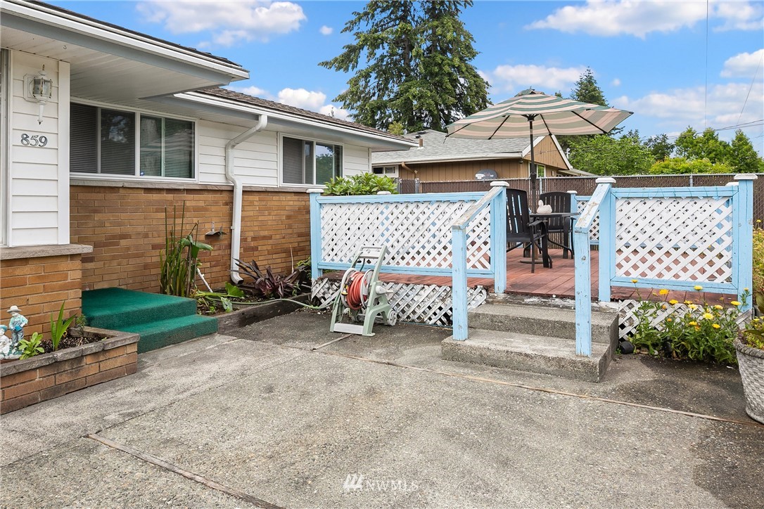 859 Monroe Avenue Northeast Renton, WA 98056 - Photo 6 of 23 a view of a house with a yard