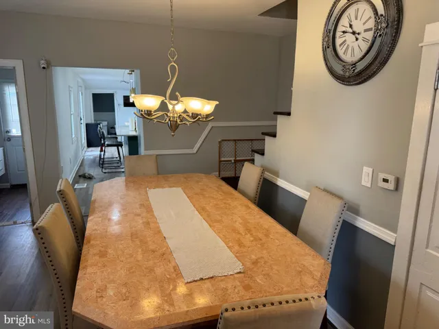 a bed room with a bed mirror and a window