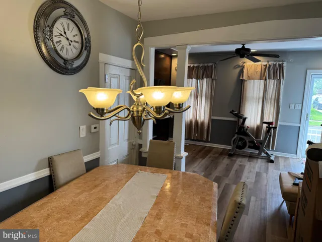 a bedroom with bed and a mirror