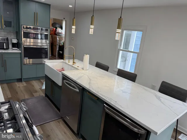 a kitchen with a sink and stove