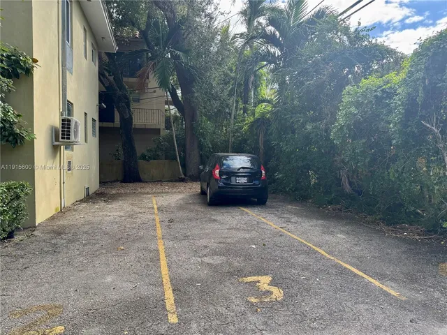 a view of a car parked in a yard