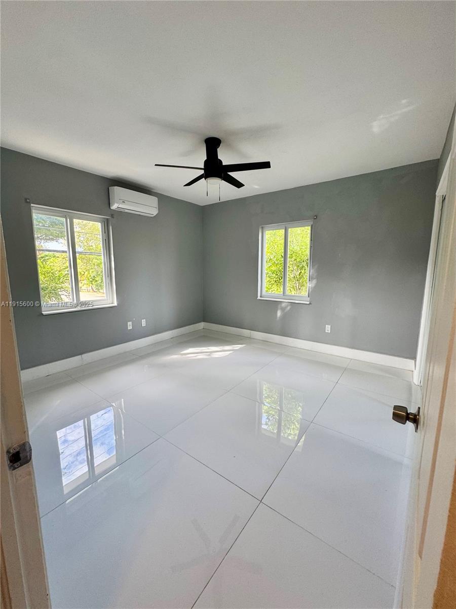300 Mendoza Avenue, Unit 3 Coral Gables, FL 33134 - Photo 9 of 19 a view of an empty room with a window