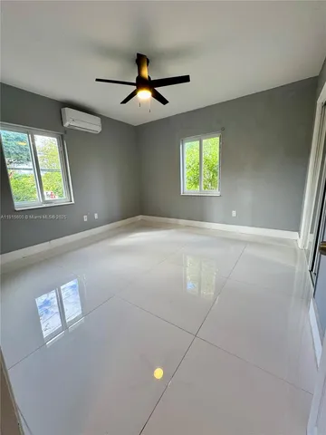 a view of an empty room with a window