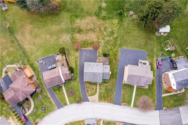an aerial view of a house with outdoor space