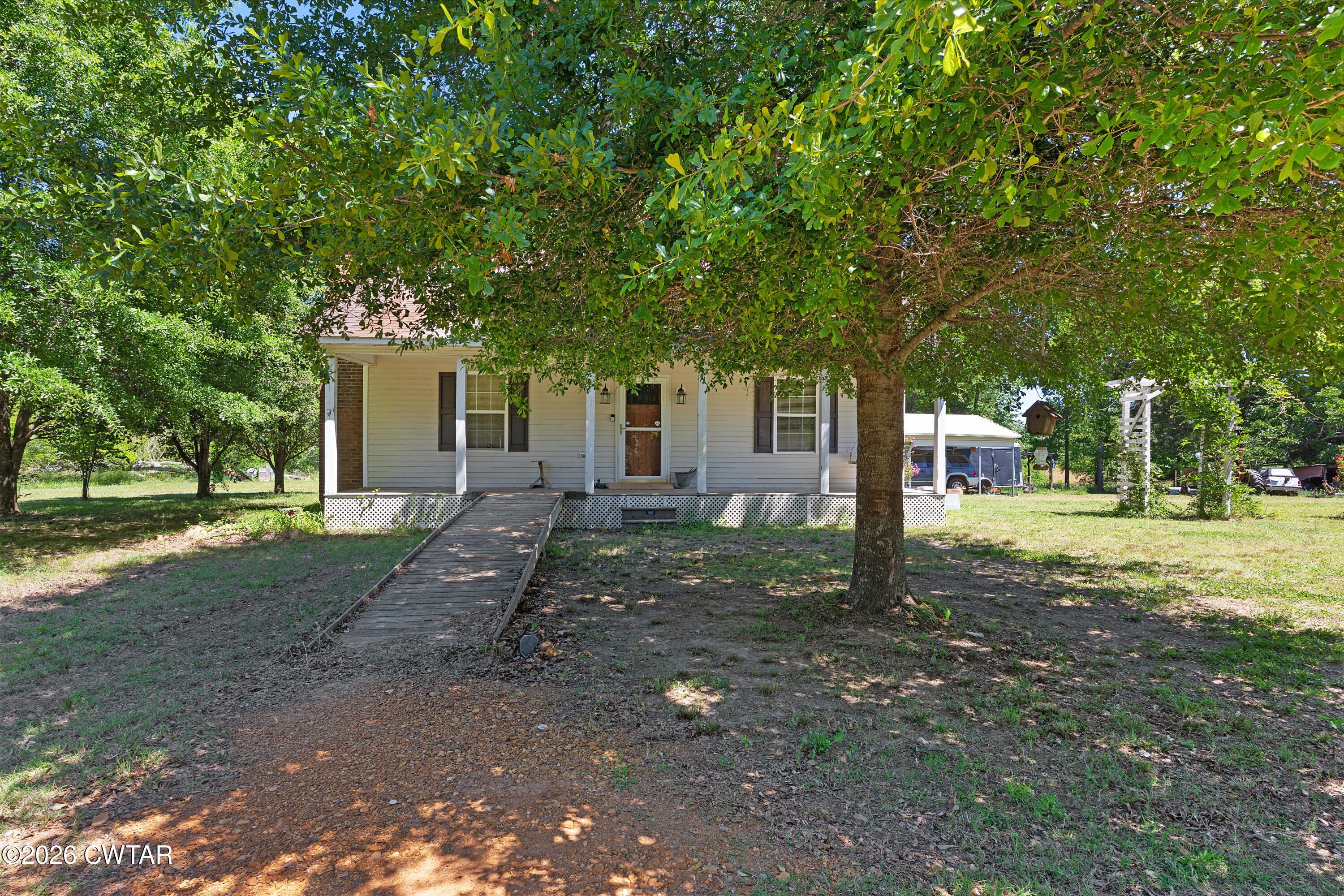 935 Parkers Camp Road Saltillo, TN 38370 - Photo 1 of 29 a view of a house with a yard