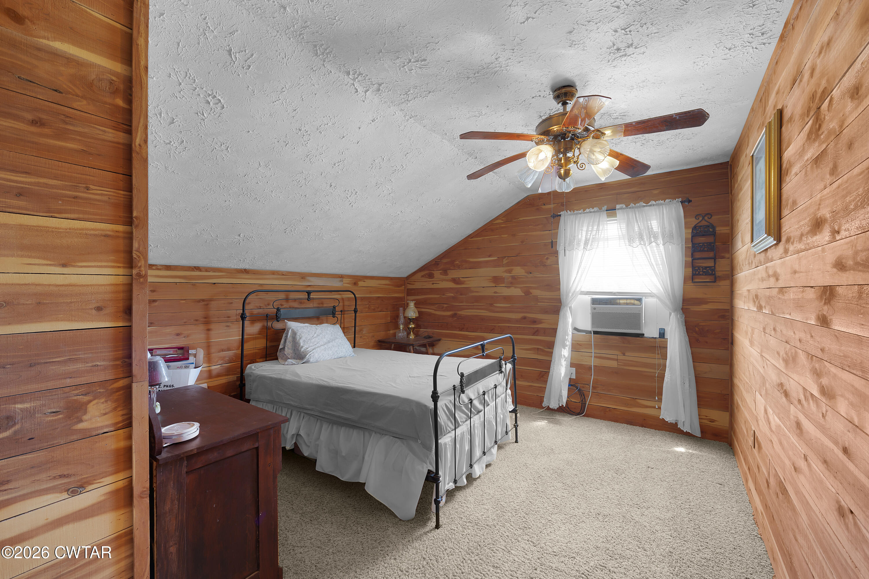 935 Parkers Camp Road Saltillo, TN 38370 - Photo 15 of 29 a bedroom with a bed and a ceiling fan