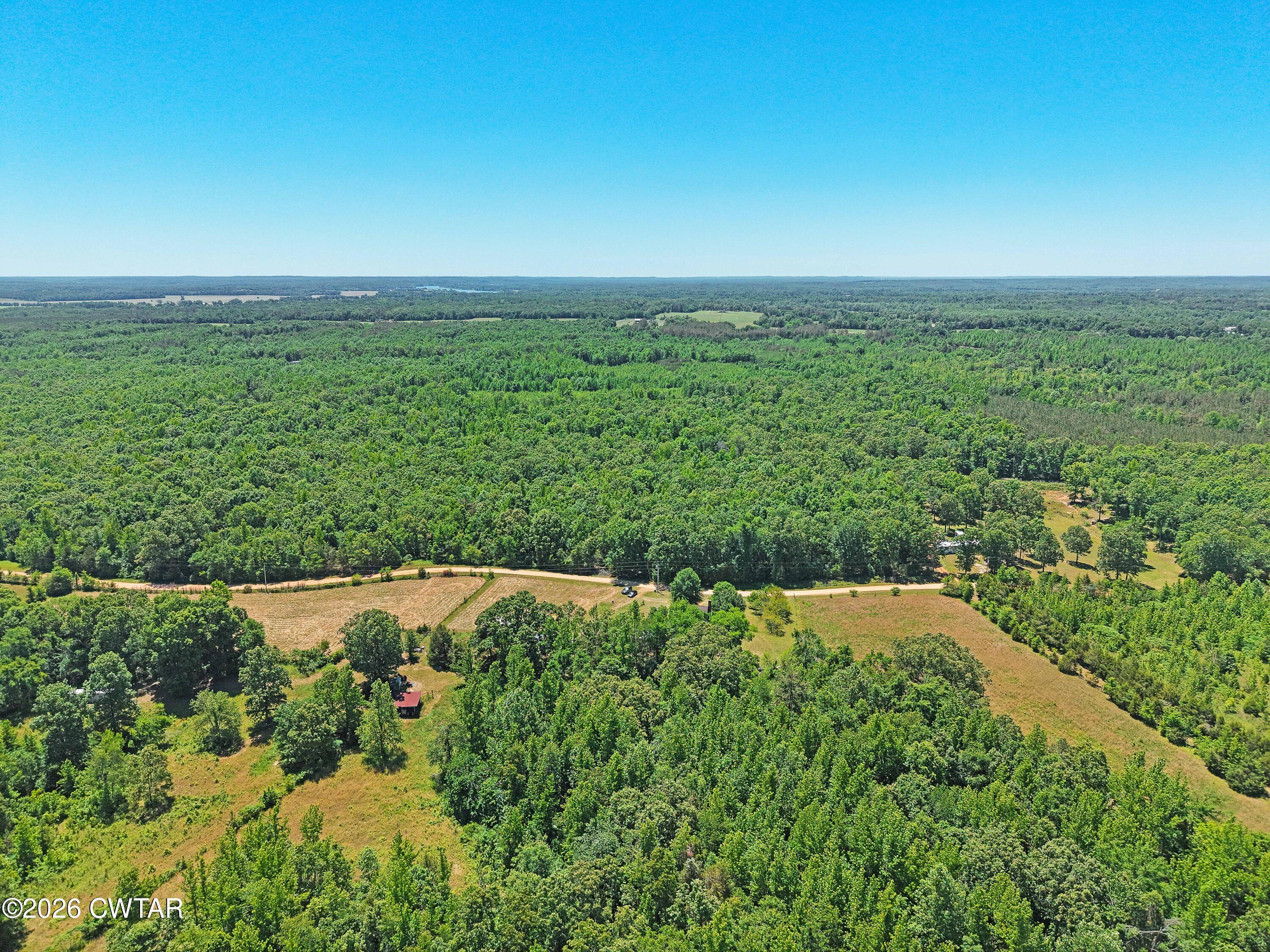 935 Parkers Camp Road Saltillo, TN 38370 - Photo 24 of 29 a view of an outdoor space with a lake view