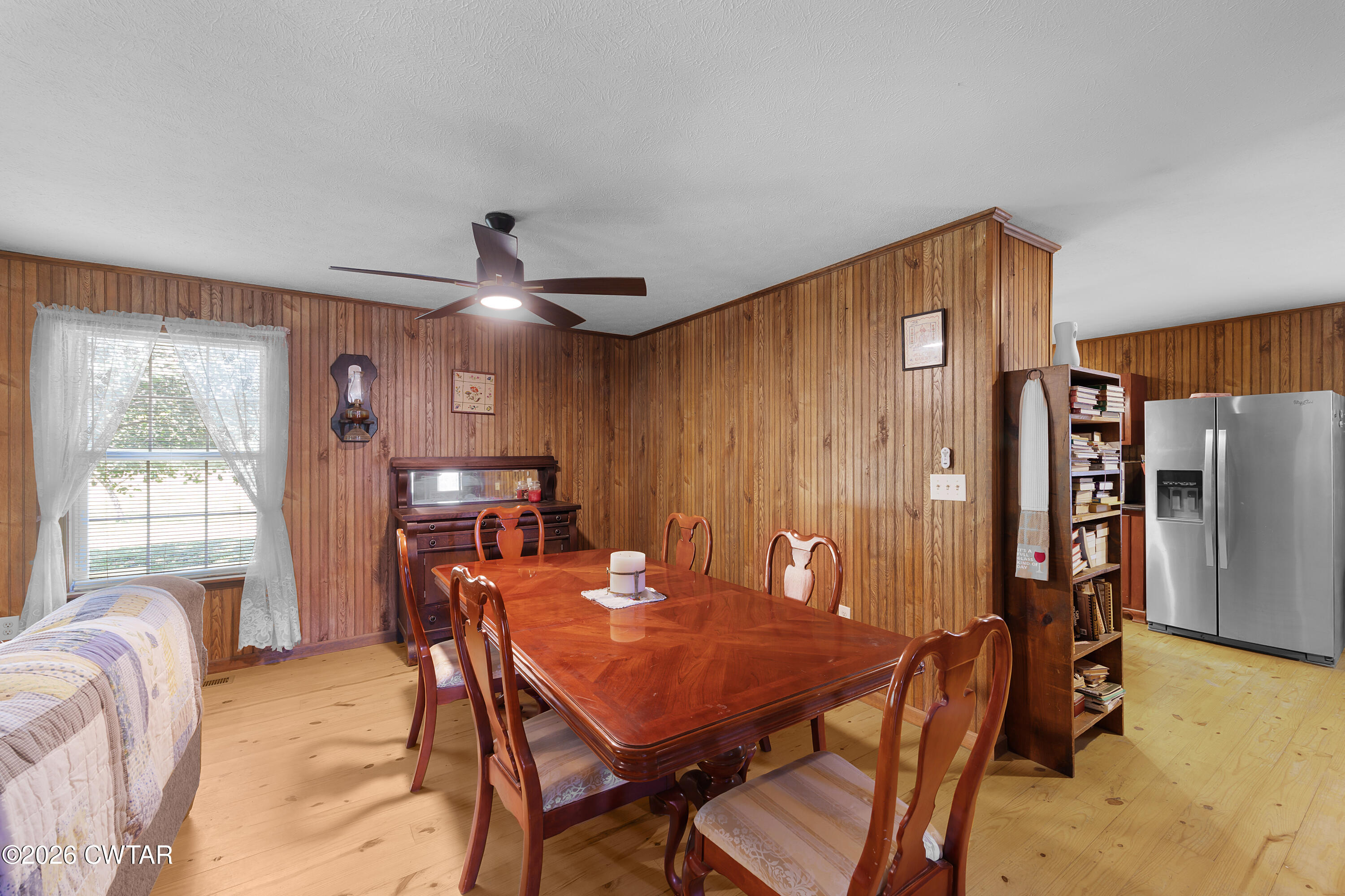 935 Parkers Camp Road Saltillo, TN 38370 - Photo 5 of 29 a view of a dining room with furniture