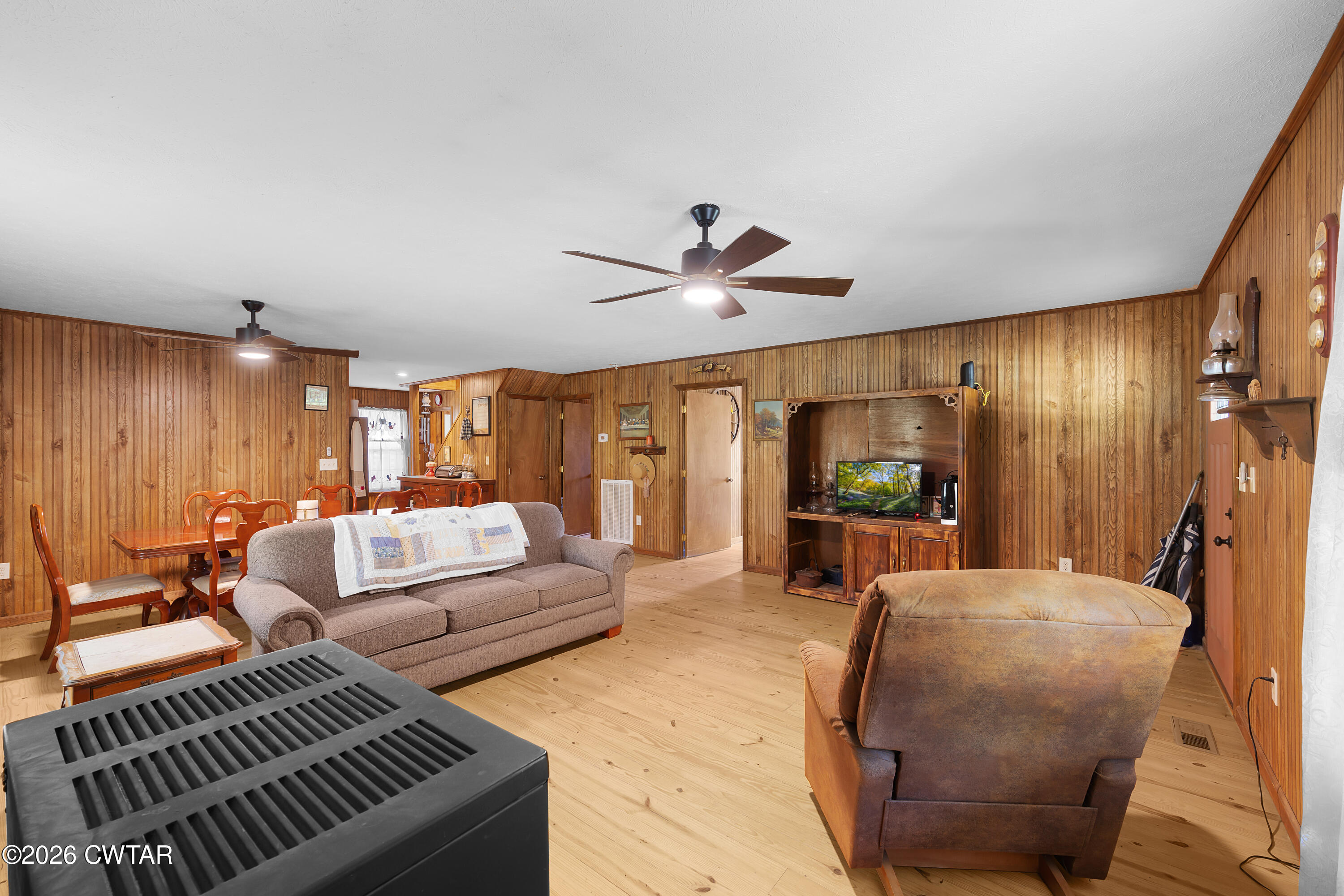 935 Parkers Camp Road Saltillo, TN 38370 - Photo 8 of 29 a living room with furniture a large window and a chandelier