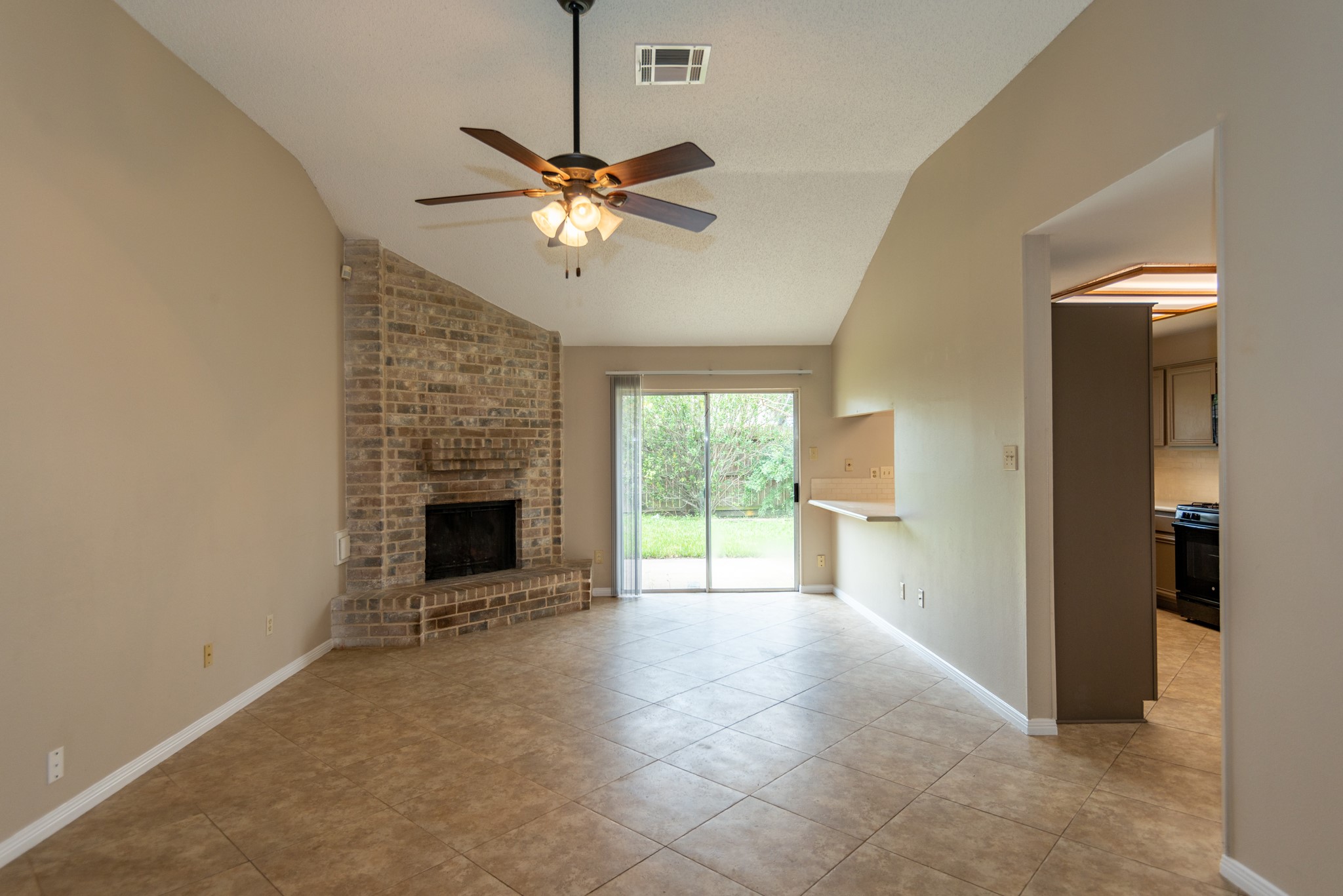 12034 Paddock Way Houston, TX 77065 - Photo 9 of 19 Lovely corner fireplace located next to large glass sliding door