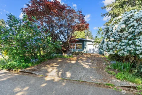 a view of a house with a tree
