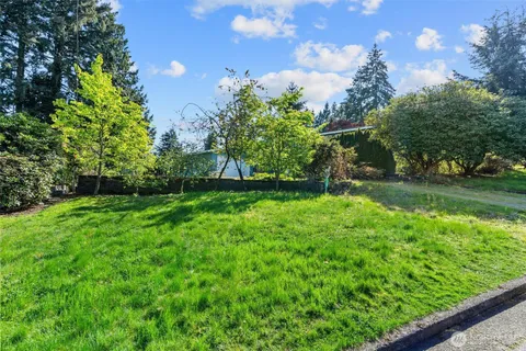 a view of a playground with a house