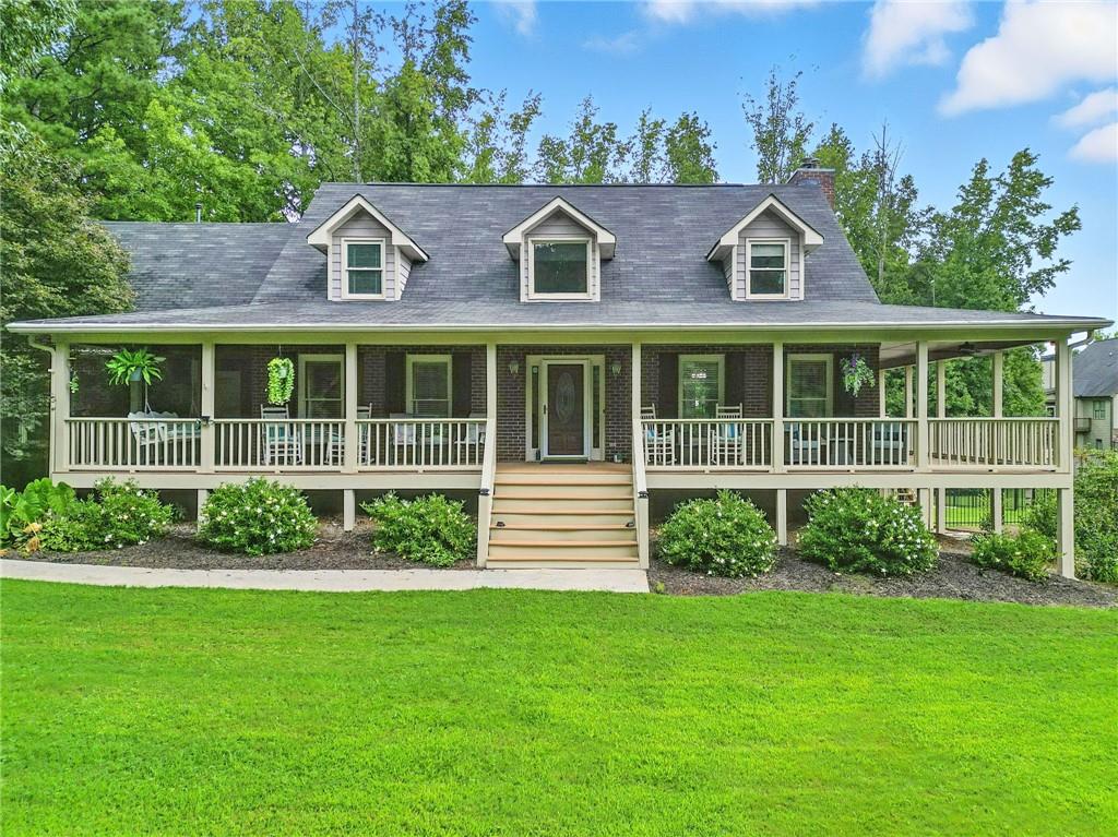 a front view of a house with a garden