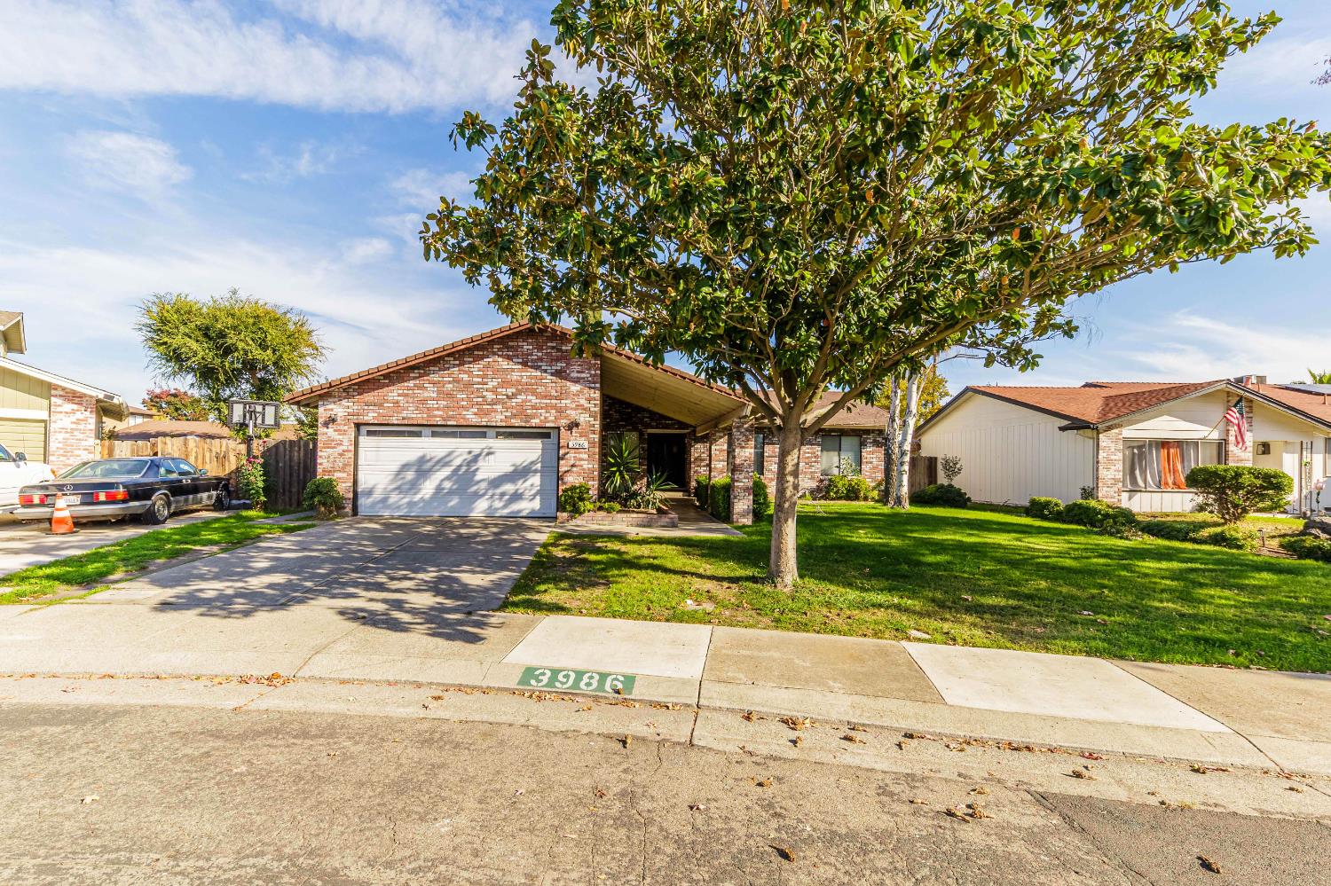 3986 Chatsworth Circle Stockton, CA 95209 - Photo 1 of 1 a view of a house with a yard and large tree