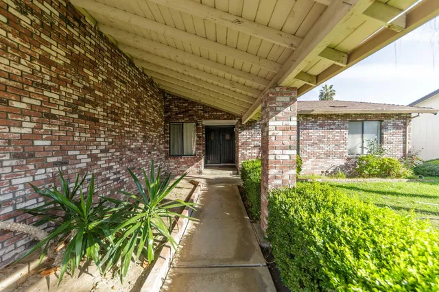 a view of empty room with fireplace