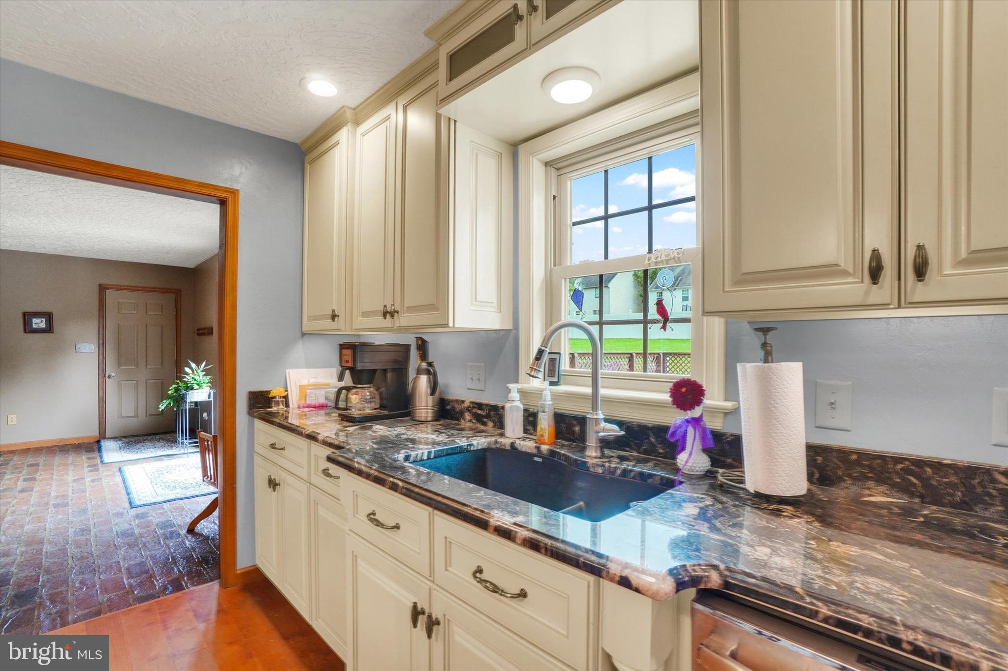 441 School Road York, PA 17407 - Photo 14 of 34 a kitchen with granite countertop a sink stainless steel appliances white cabinets and a window