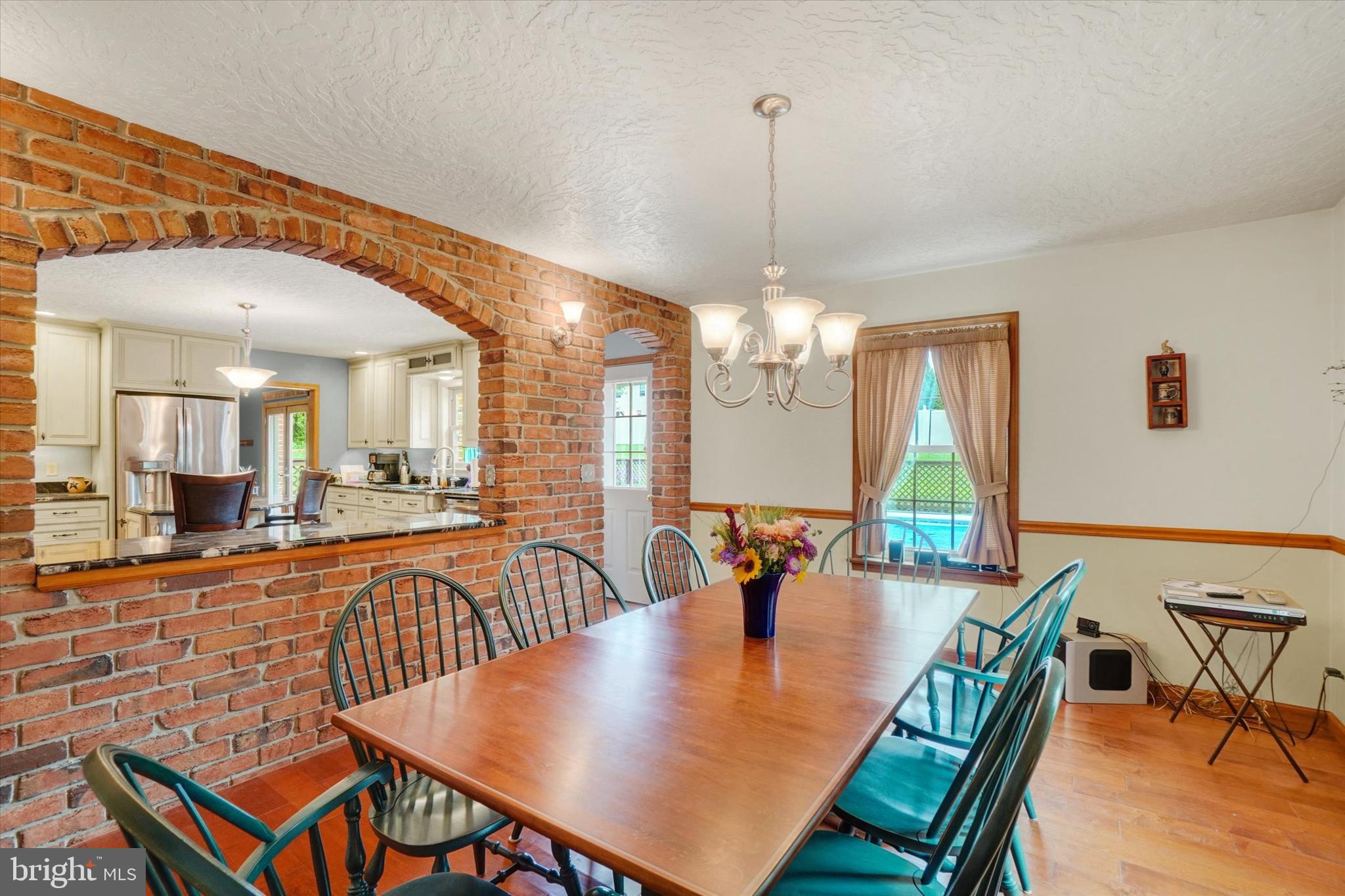 441 School Road York, PA 17407 - Photo 18 of 34 a view of a dining room and livingroom with furniture wooden floor a chandelier