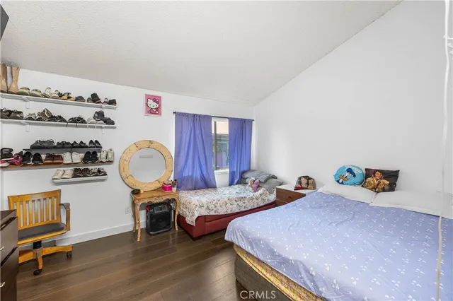 a bedroom with bed and a window