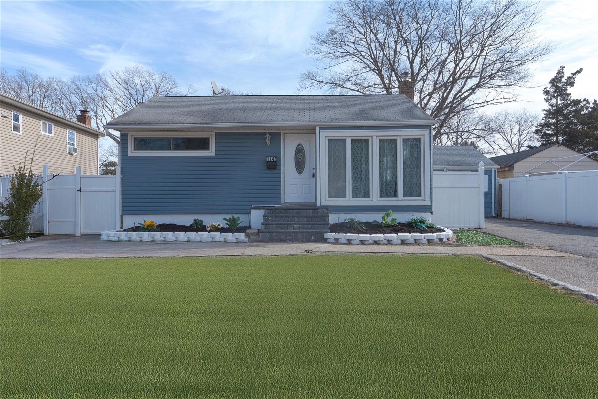 1141 Udall Road Bay Shore, NY 11706 - Photo 1 of 1 View of front of home featuring a front yard