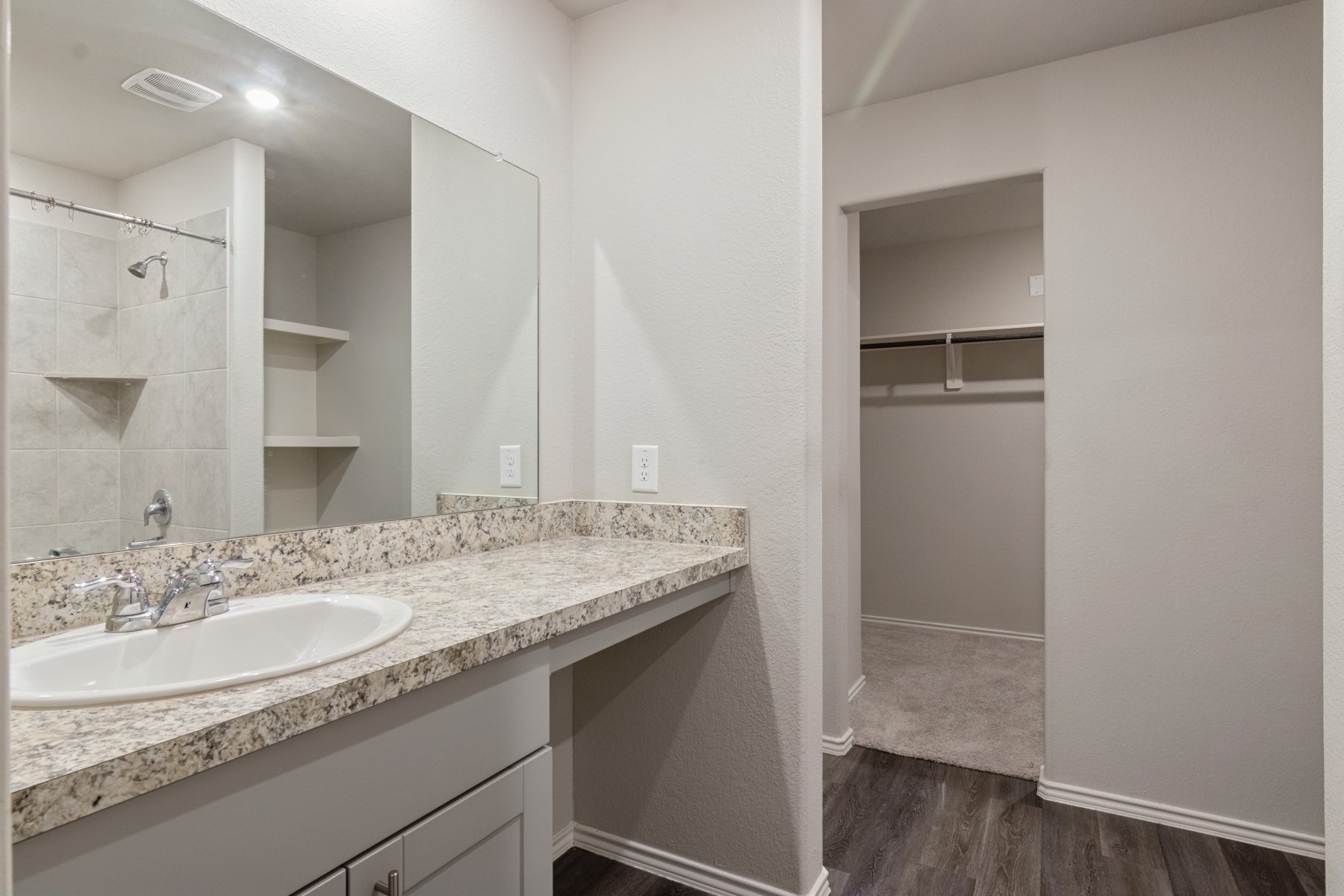 2250 Yelverton Ter Trail Spring, TX 77373 - Photo 17 of 30 a bathroom with a granite countertop sink and a mirror