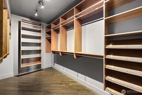 a view of walk in closet with empty racks