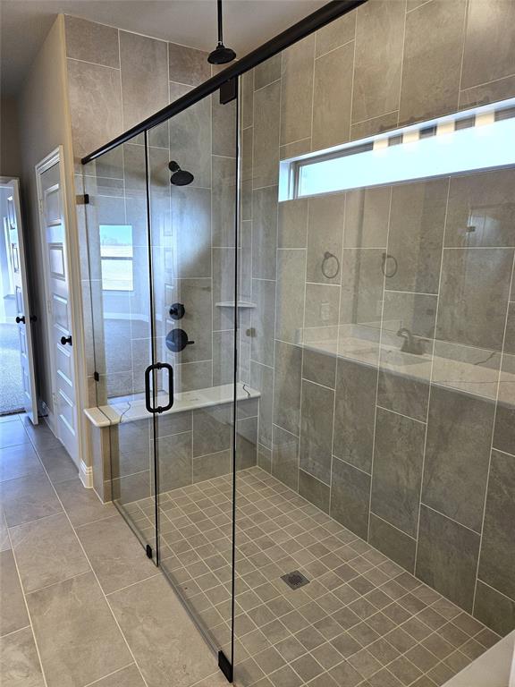 1429 Enloe Road Howe, TX 75459 - Photo 16 of 19 a bathroom with a shower and a mirror