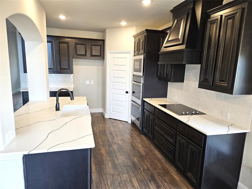 1429 Enloe Road Howe, TX 75459 - Photo 2 of 19 a kitchen with stainless steel appliances a sink stove and refrigerator