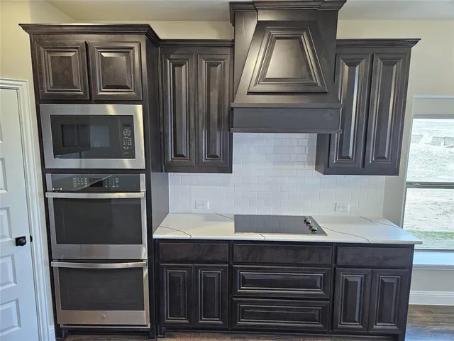 a kitchen with a refrigerator and a sink
