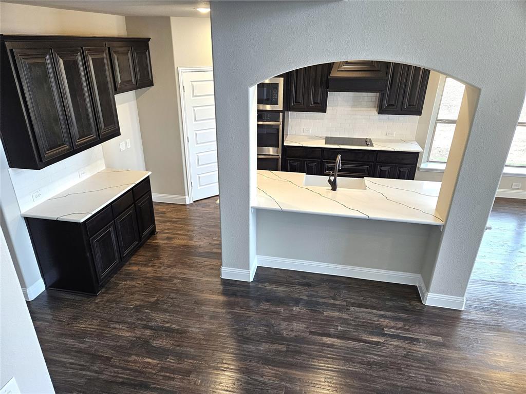 1429 Enloe Road Howe, TX 75459 - Photo 7 of 19 a bathroom with a sink and a mirror