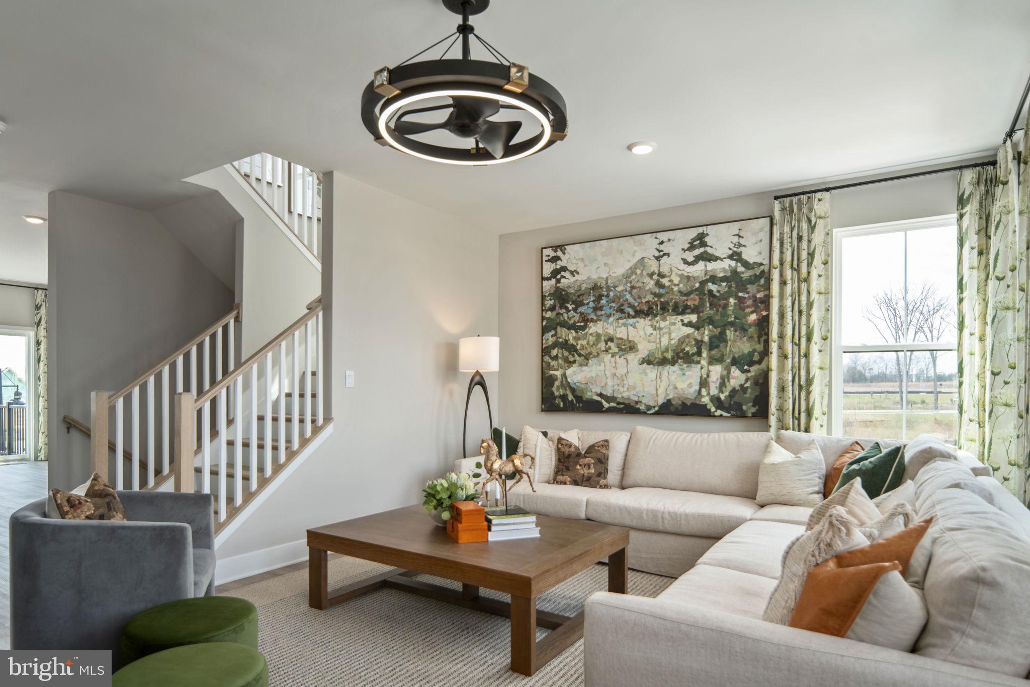 11371 Hypatia Loop Manassas, VA 20110 - Photo 13 of 80 a living room with furniture and a large window
