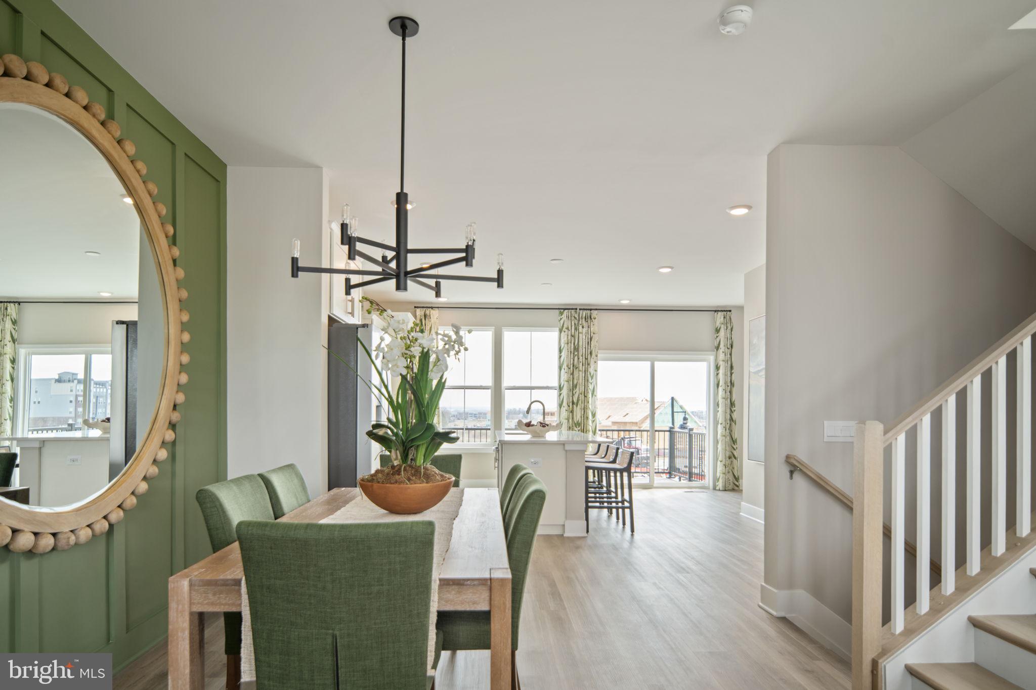 11371 Hypatia Loop Manassas, VA 20110 - Photo 15 of 80 a view of a dining room with furniture window and wooden floor