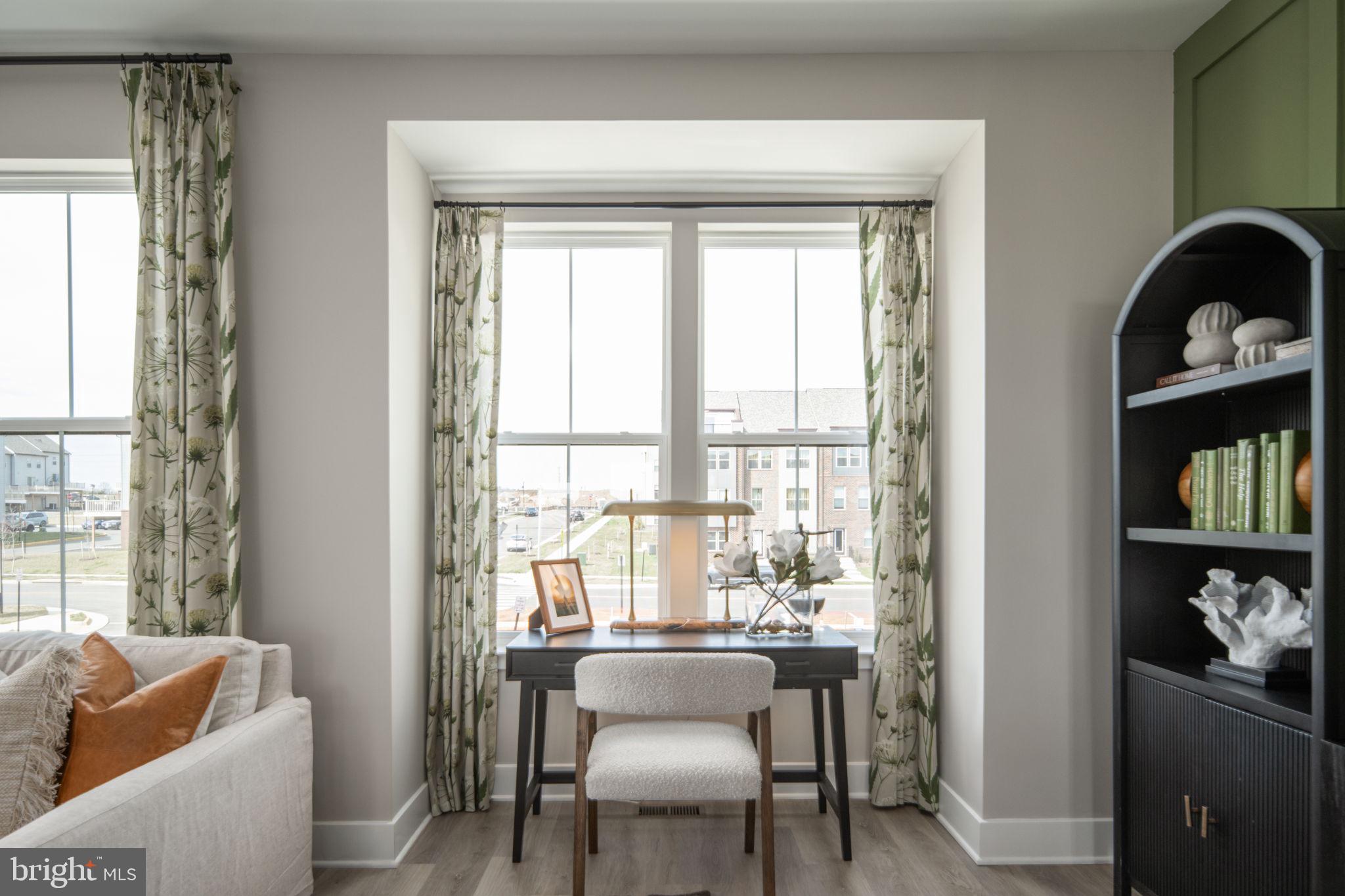 11371 Hypatia Loop Manassas, VA 20110 - Photo 19 of 80 a view of a dining room with furniture window and outside view