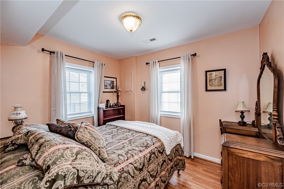 110 Hampton Road Dunnsville, VA 22454 - Photo 14 of 50 a bedroom with two beds and a window