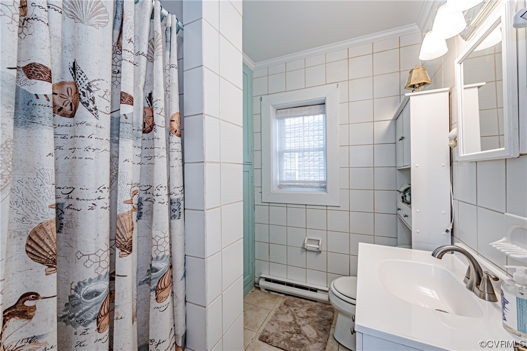 110 Hampton Road Dunnsville, VA 22454 - Photo 16 of 50 a bathroom with a sink toilet and shower