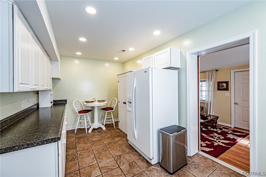 110 Hampton Road Dunnsville, VA 22454 - Photo 24 of 50 a kitchen with stainless steel appliances granite countertop a refrigerator and a stove top oven