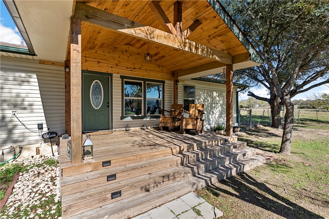 8801 Old Reliance Road Bryan, TX 77808 - Photo 3 of 24 Spacious front porch offers a peaceful place to sit and enjoy the property.