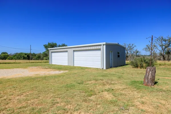 a view of a backyard of a house